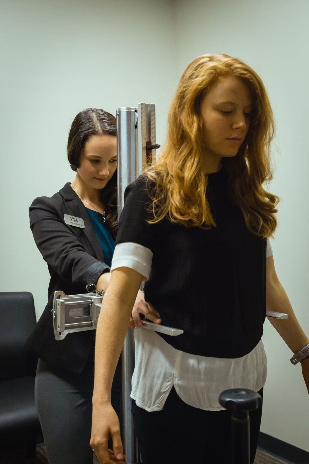 Consultation and postural examination at Vital Brain & Spine